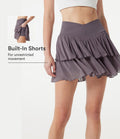 Jupe-short tennis mini fluide taille haute croisée en mesh à volants, avec poches