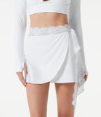 Jupe mini de sport SoftlyZero™ Plush, taille moyenne, maille contrastée, nouée sur le côté, drapée