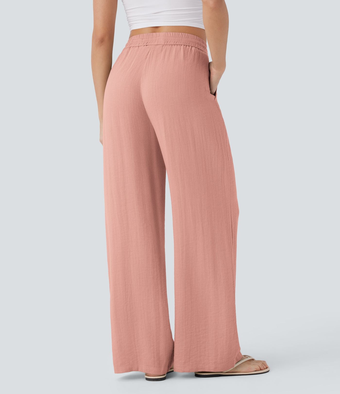 Pantalon large fluide taille haute avec cordon de serrage, poches latérales et aspect lin