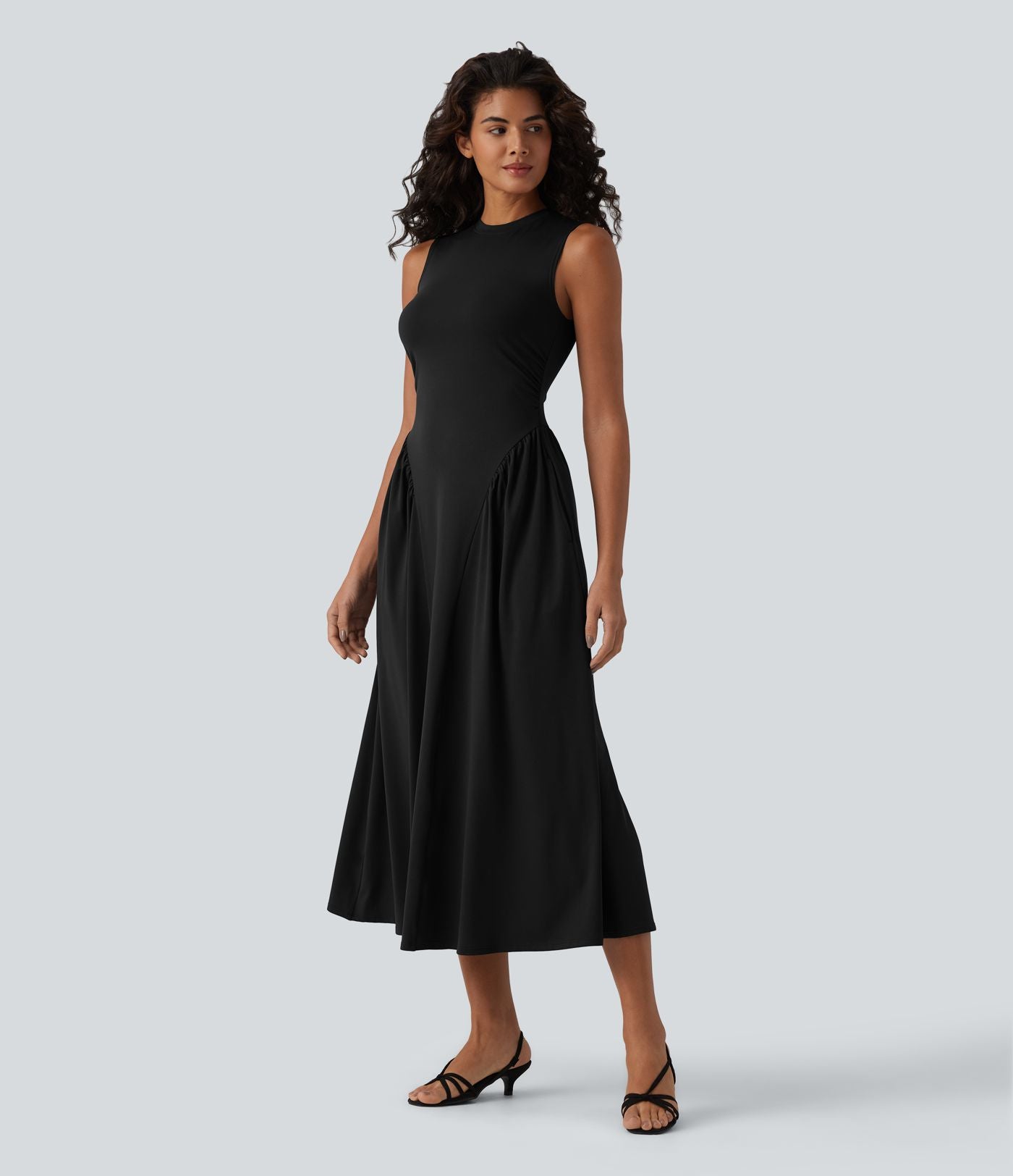 Robe midi casual fluide sans manches à col rond avec poches