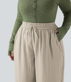 Pantalon grande taille large fluide taille haute avec cordon de serrage, poches et aspect lin