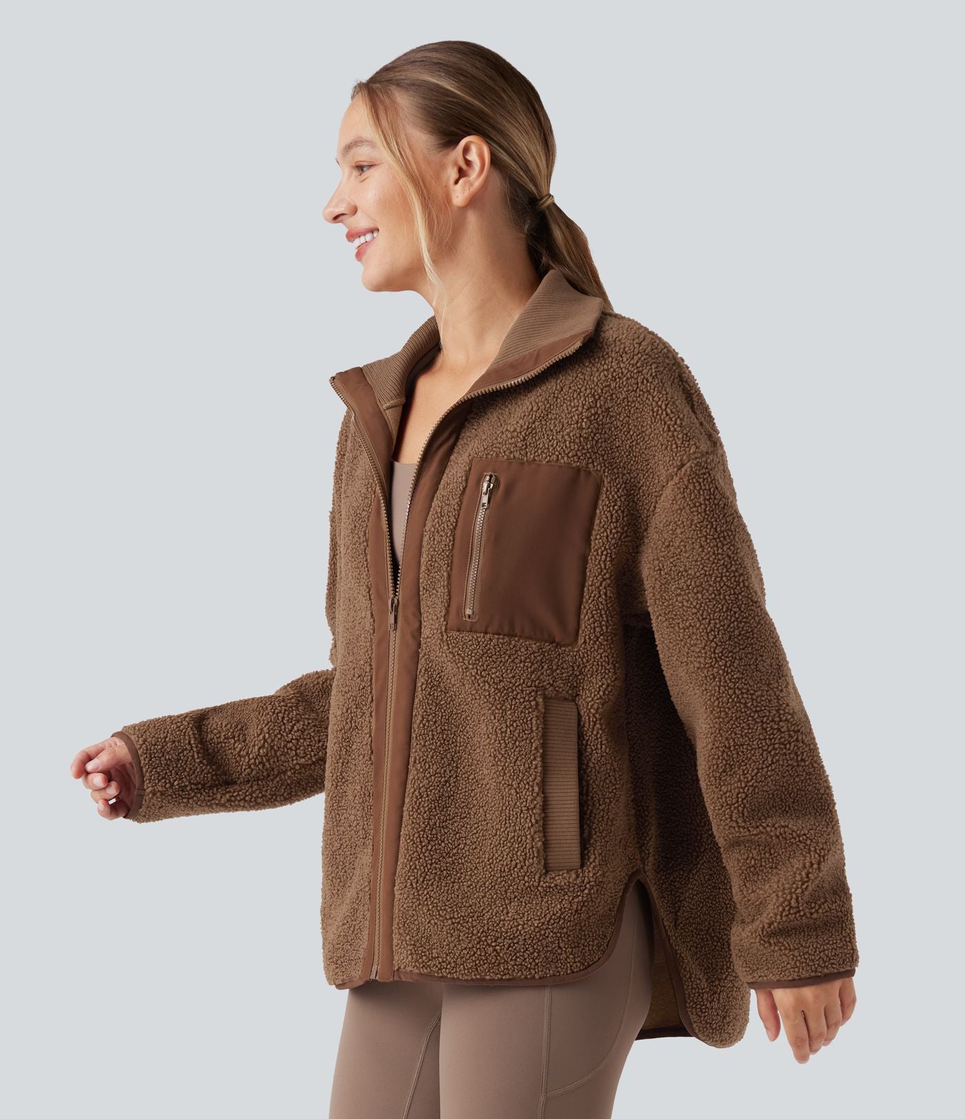 Veste de sport sherpa à manches longues avec ourlet asymétrique arrondi et poches