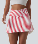 Jupe de tennis mini 2 en 1 à rayures, taille haute croisée, ourlet arrondi et poches