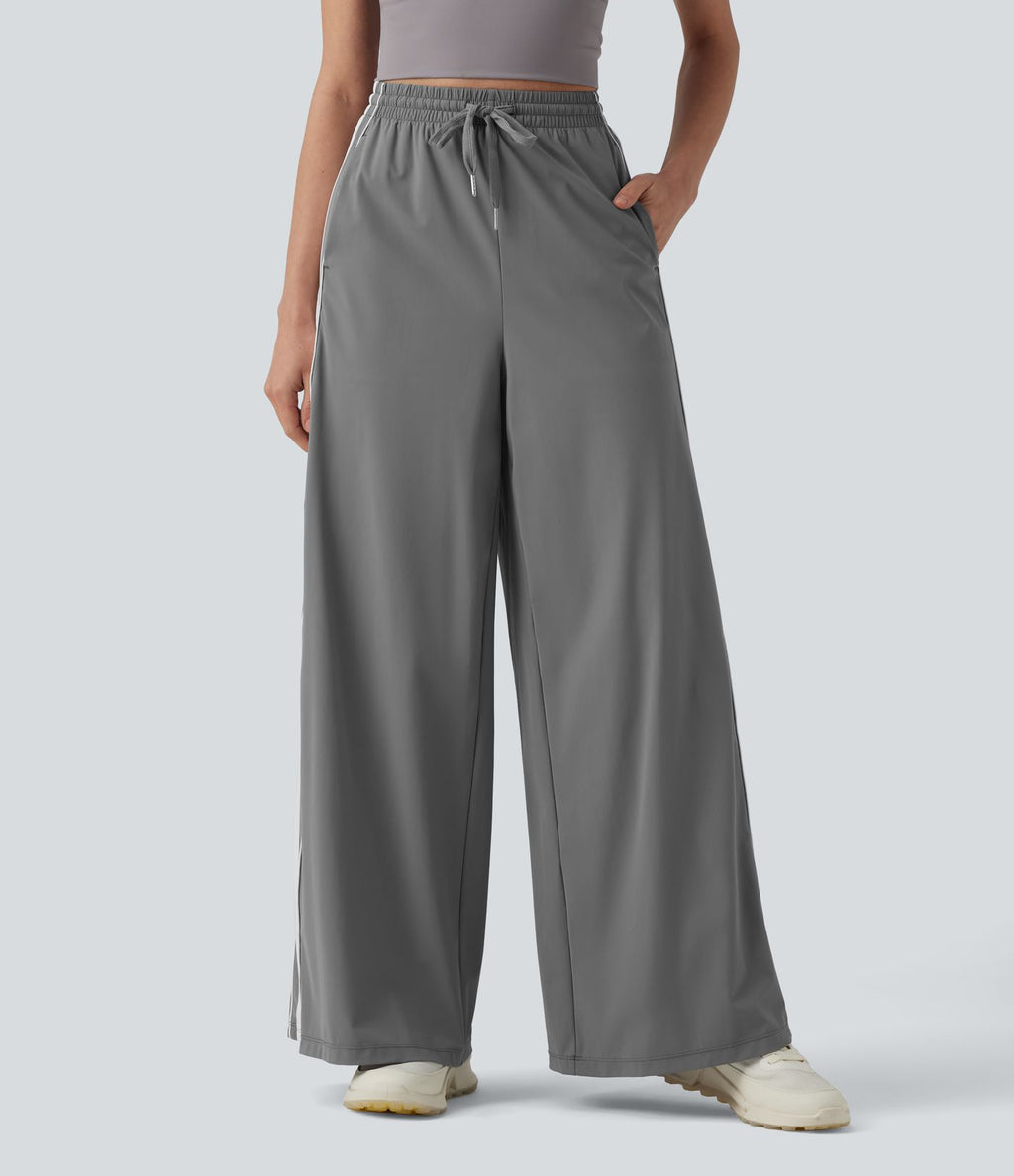Pantalon running large à rayures taille haute avec cordon de serrage, séchage rapide et effet frais InstantCool avec poches, protection solaire UPF40+