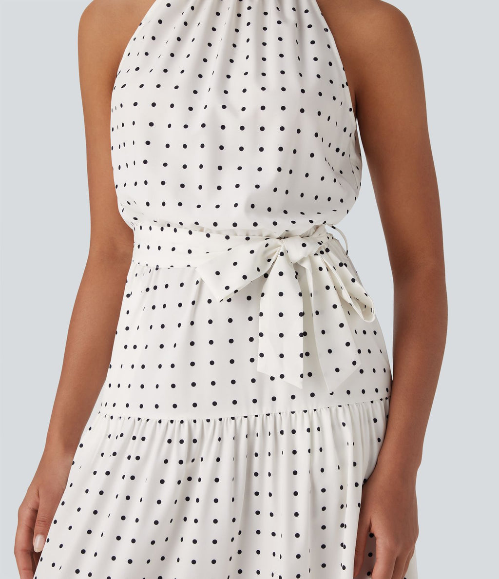 Robe mi-longue fluide de vacances à pois avec col licou, découpe dos, ceinture et poches latérales