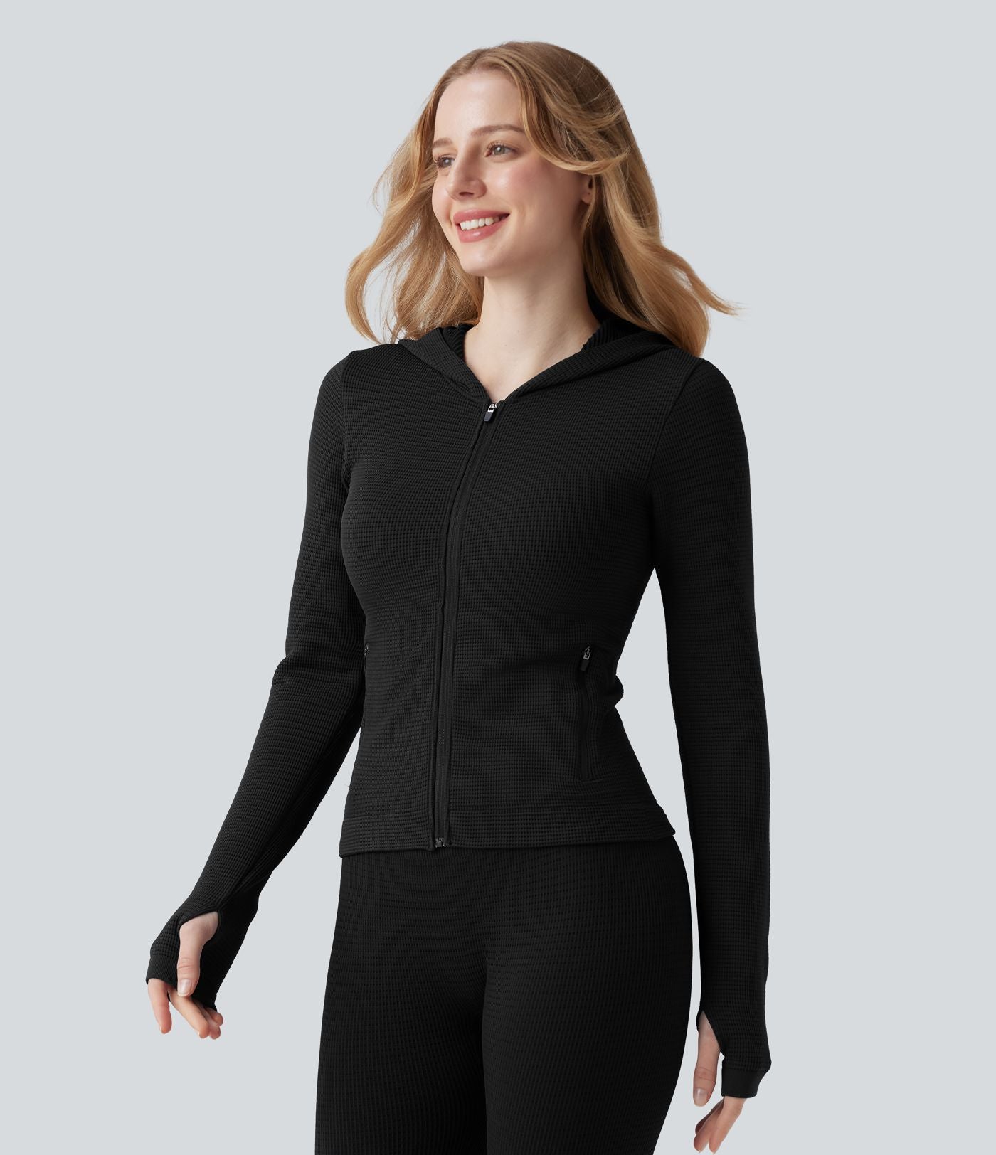 Veste yoga en maille gaufrée à capuche zippée à manches longues avec passants pouces sans couture OneForm Seamless Flow avec poches