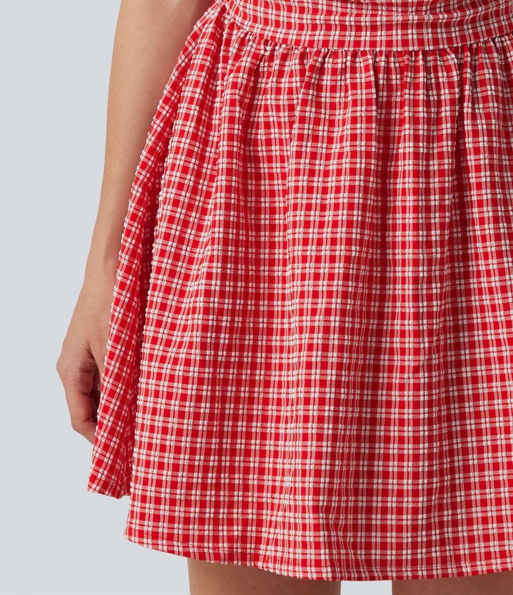Robe mini trapèze vichy sans manches à col bateau, détails froncés, fermeture invisible et poches