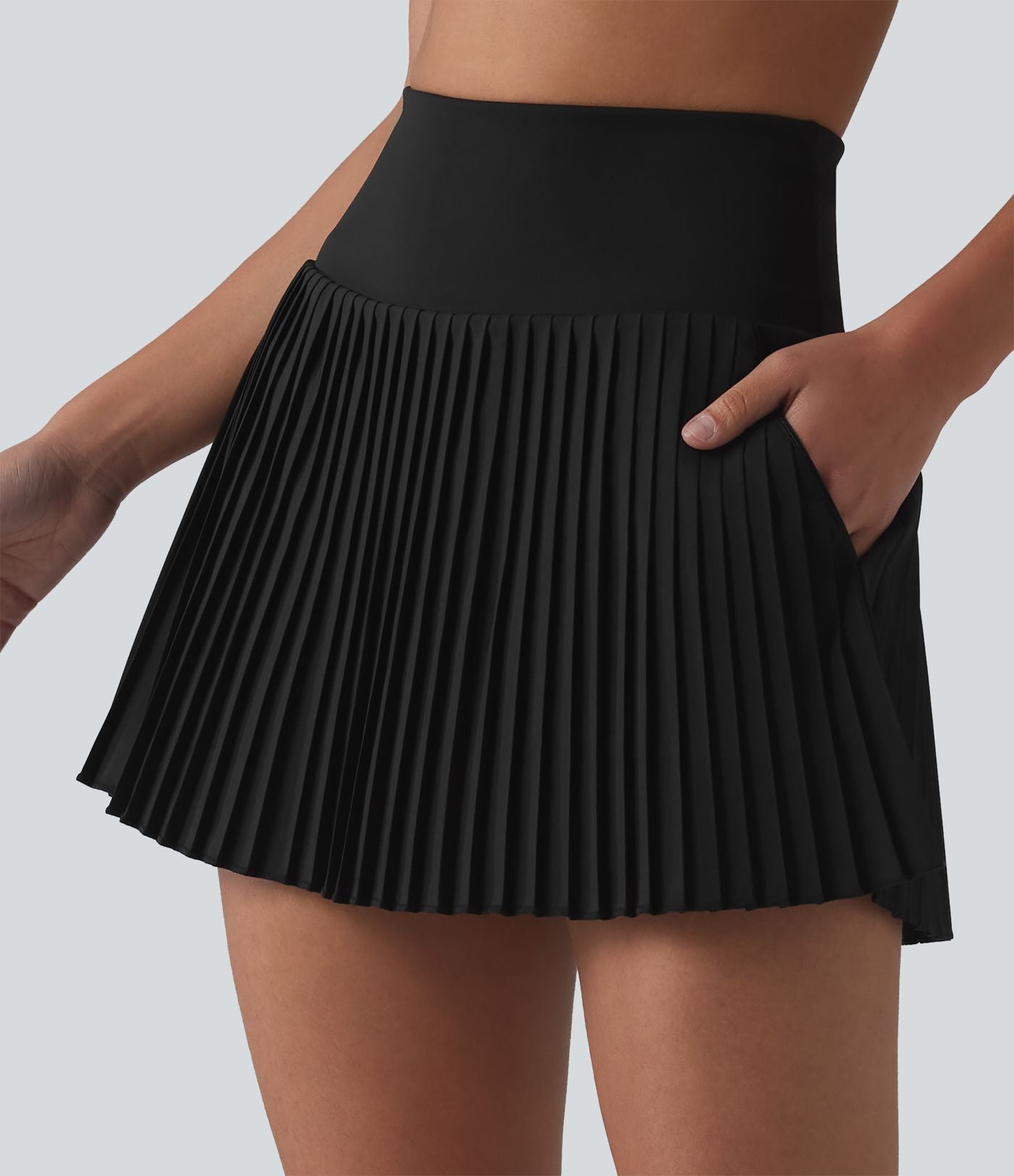 Breezeful™ Jupe mini de tennis plissée 2 en 1 taille haute séchage rapide avec poches