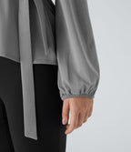 Blouse de travail à col châle, effet cache-cœur, lien sur le côté et ourlet à volants