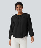 Blouse texturée col rond manches longues ourlet arrondi