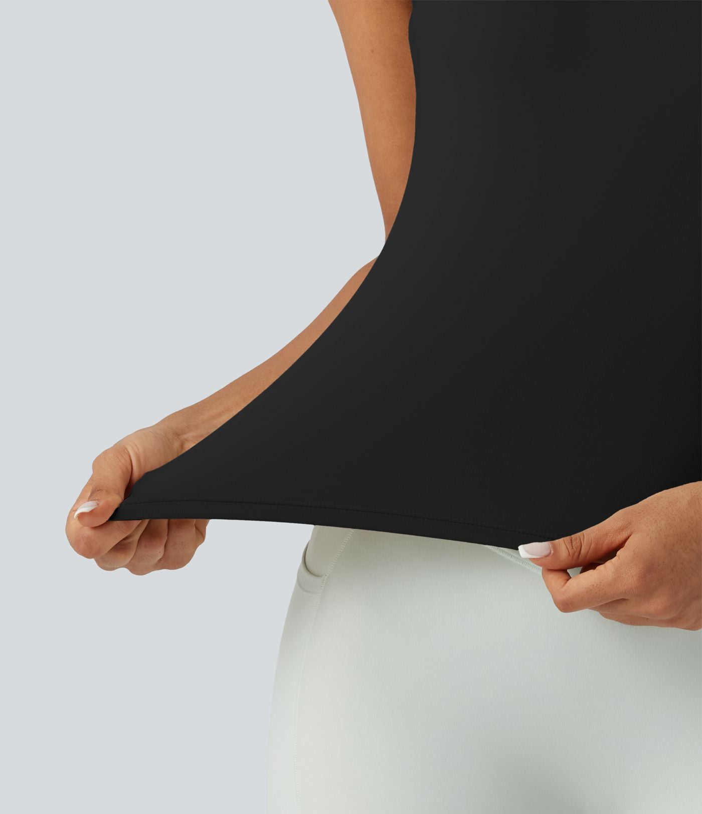 Débardeur de sport effet lissant sous les bras avec dos en V et brassière intégrée