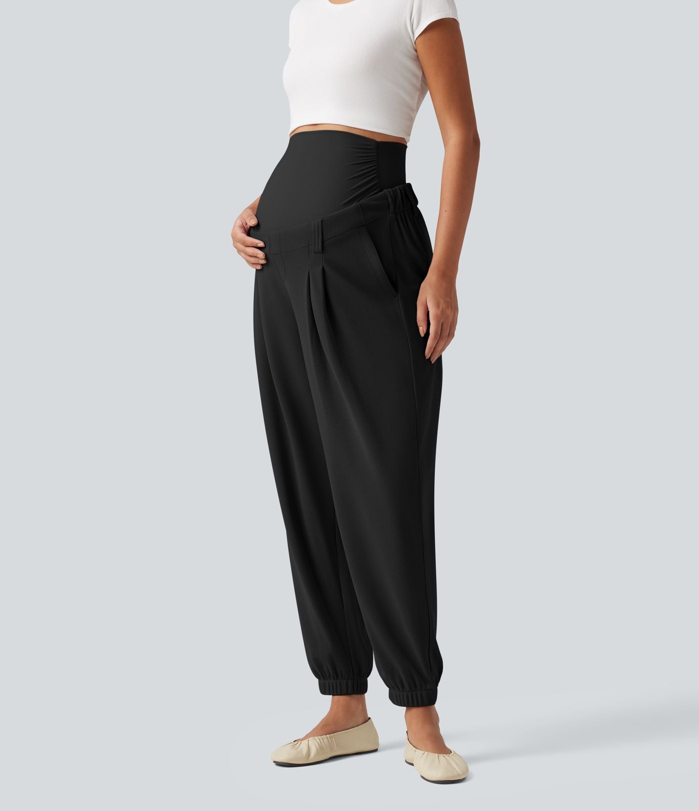 Pantalon de grossesse fuselé taille très haute en tissu gaufré avec poches
