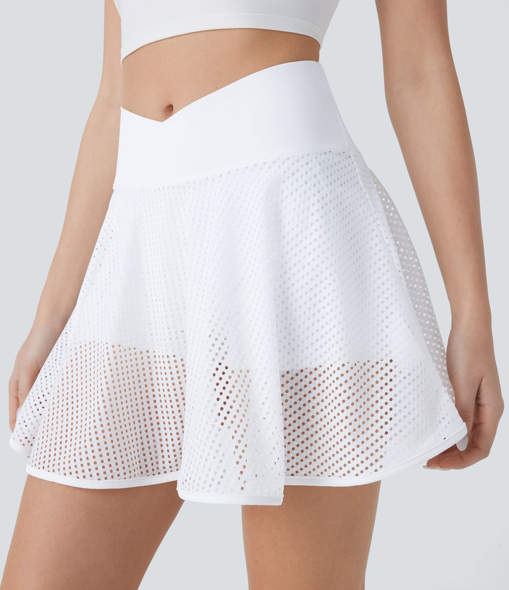 Jupe courte de yoga évasée 2-en-1 taille haute croisée avec poches latérales et motif perforé