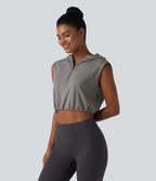 Débardeur de yoga court à capuche avec demi-zip