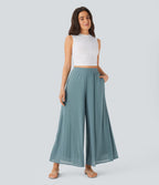 Pantalon fluide et ample avec superposition en mesh, poches latérales et taille haute