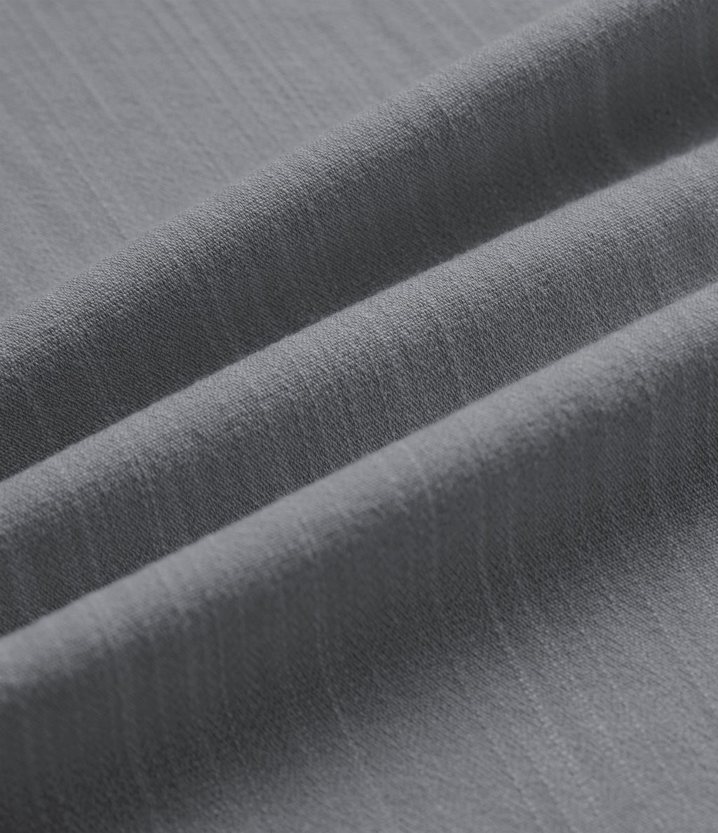 Pantalon tailleur asymétrique effet lin, taille moyenne, coupe ballon, à poches