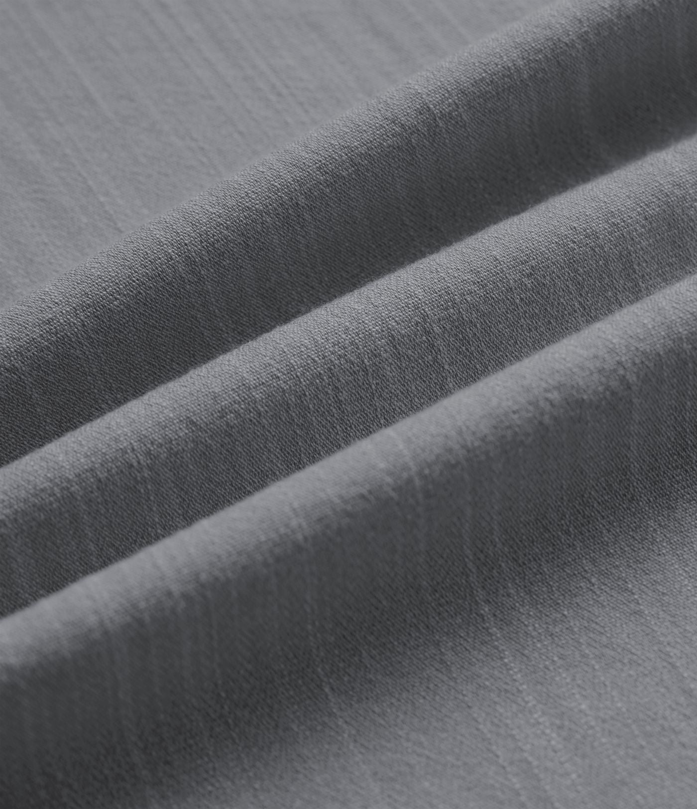 Pantalon tailleur asymétrique effet lin, taille moyenne, coupe ballon, à poches