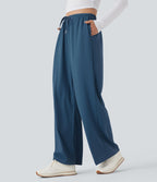Pantalon de yoga tissu gaufré taille mi-haute jambe droite avec cordon de serrage et poches