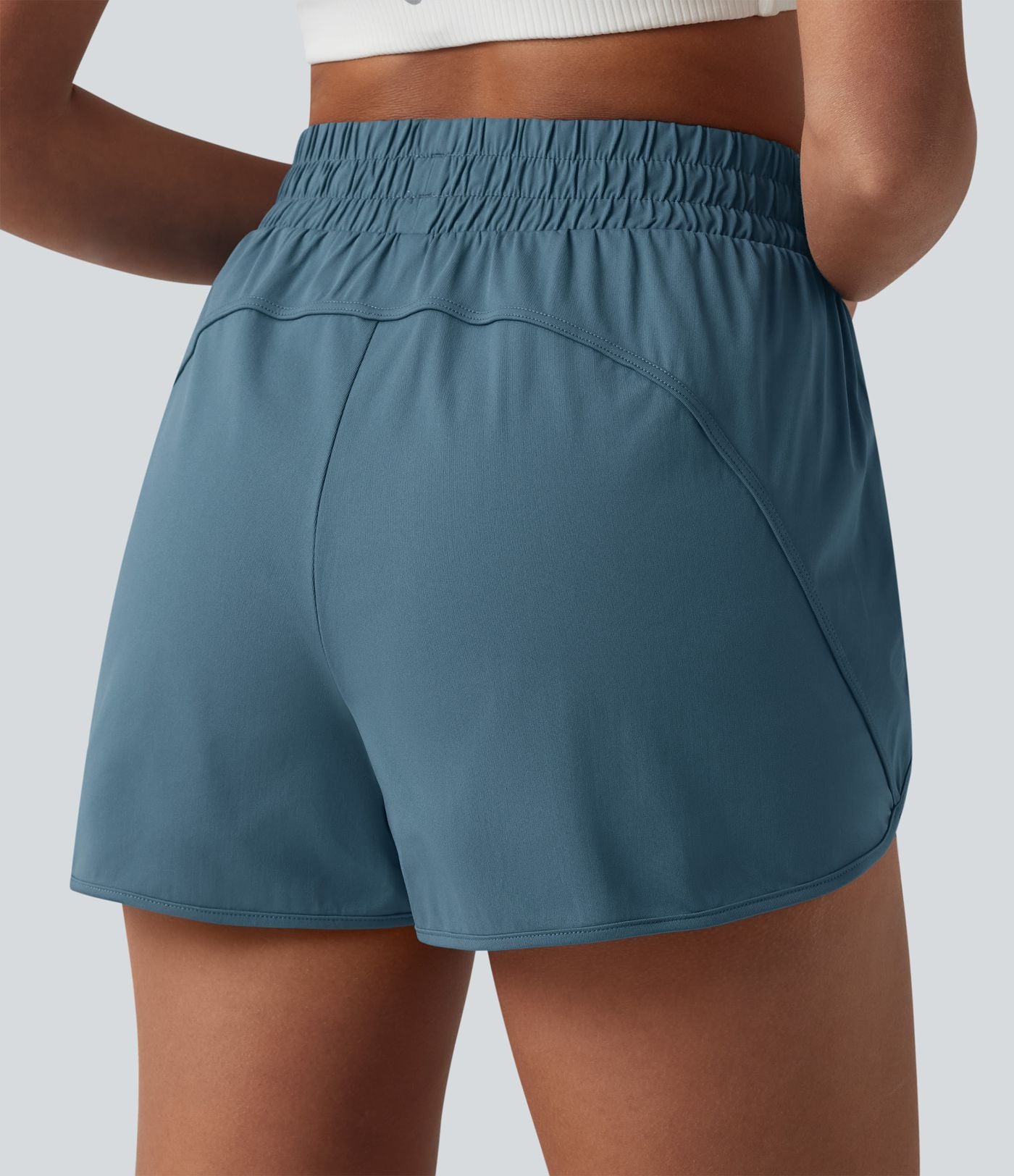 Short de yoga 7,5 cm taille haute à ourlet arrondi et poches