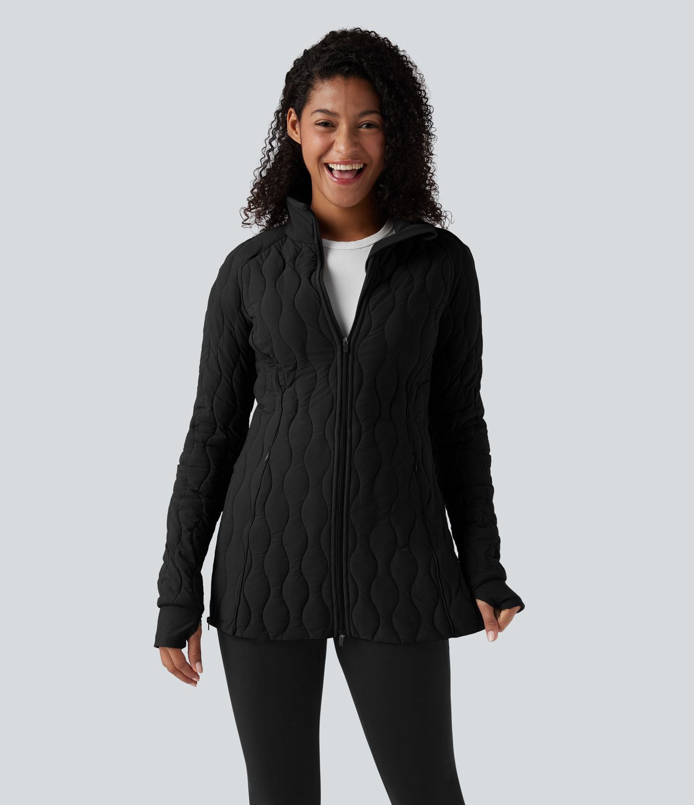 Veste matelassée de sport PuffFlex à col montant, manches longues, fermeture éclair avec passe-pouces et poches