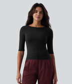 Top tailleur en mélange de laine col rond échancré à manches courtes en maille côtelée