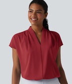 Blouse esprit bureau ample défroissage facile, col V et manches chauve-souris
