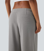 Pantalon décontracté taille basse à jambes larges en tissu gaufré avec poches latérales