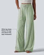 Pantalon large fluide en lin stretch taille haute avec cordon de serrage et poches