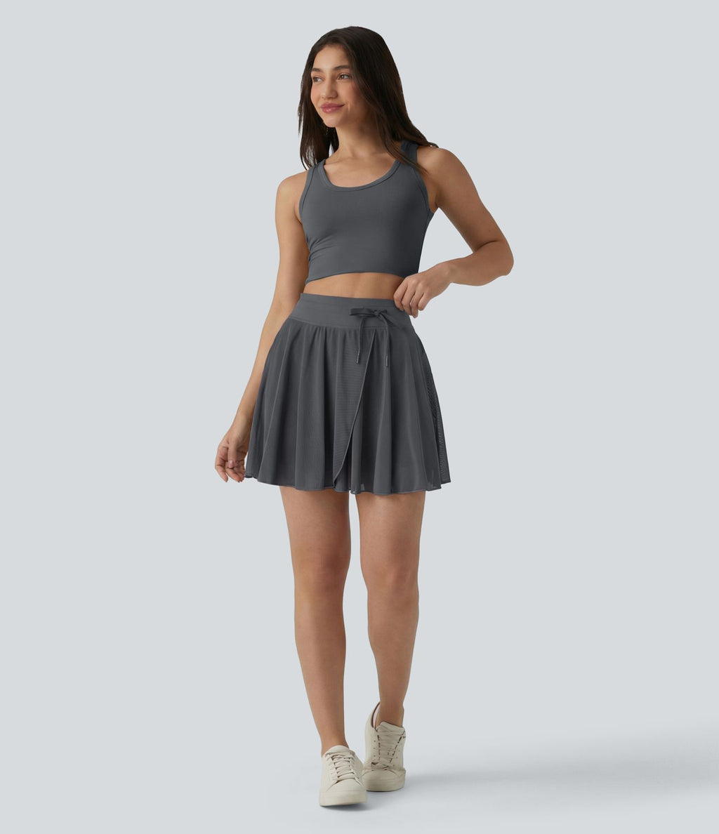 Jupe mini fluide évasée 2-en-1 taille haute à cordon, empiècements en mesh contrastant, avec poche, version plus longue