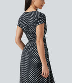 Robe midi à pois col V avec manches courtes, lien côté et poches
