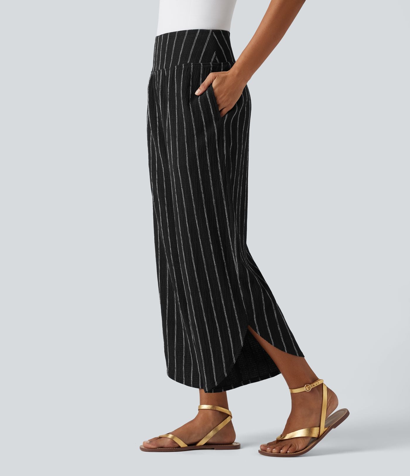 Pantalon rayé taille haute avec ourlet arrondi et poches