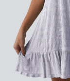 Robe courte décontractée sans manches à col rond, soutien-gorge intégré et ourlet à volants