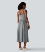 Robe midi fluide sans manches dos croisé ouvert avec poches
