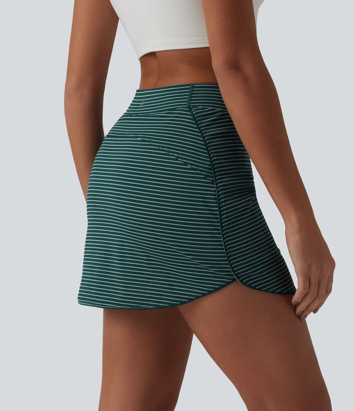 Jupe de golf mini moulante 2-en-1 taille haute à rayures avec poches