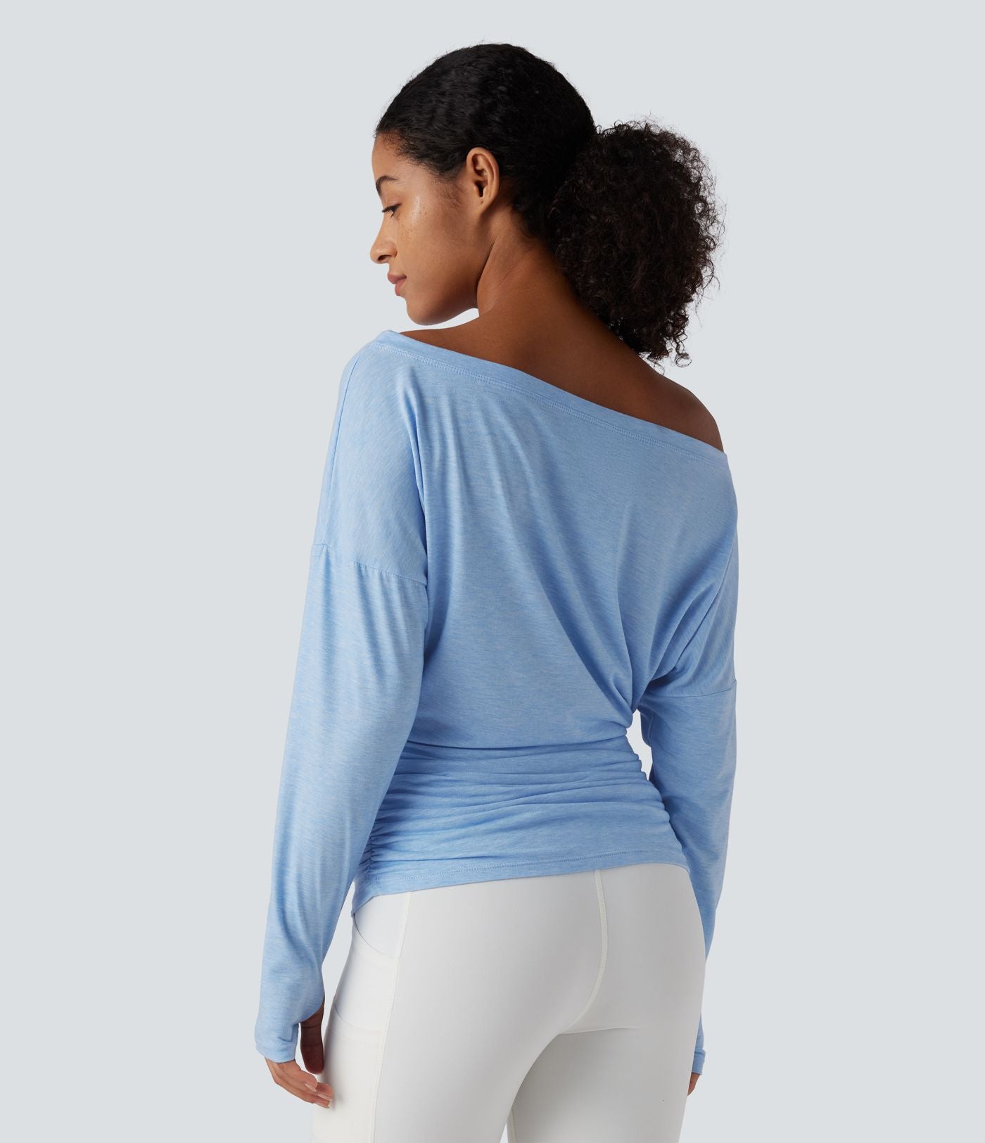 Haut de sport yoga asymétrique manches longues à trous pouces froncé