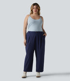Pantalon grande taille en popeline stretch taille haute, plissé avec ourlet roulotté, longueur 7/8, coupe fuselée, avec poches