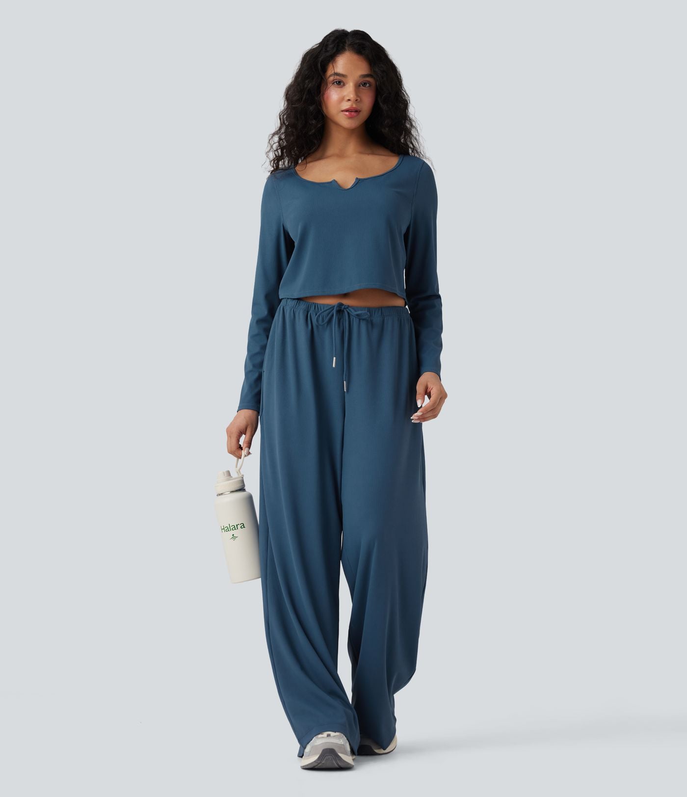 Pantalon de yoga tissu gaufré taille mi-haute jambe droite avec cordon de serrage et poches