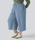 Pantalon grande taille large fluide taille haute avec cordon de serrage, poches et aspect lin