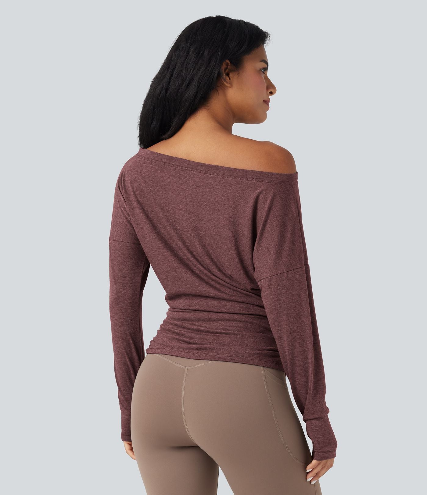 Haut de sport yoga asymétrique manches longues à trous pouces froncé