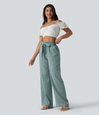 Pantalon décontracté effet lin taille haute, coupe droite, ceinturé avec finitions ondulées et poches
