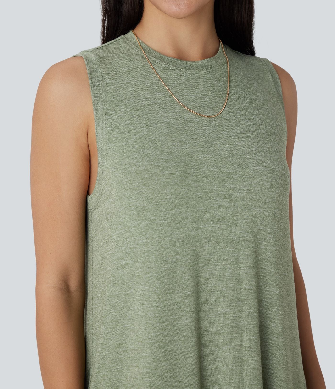 Robe longue décontractée fluide à col rond, sans manches, poches latérales et ourlet asymétrique