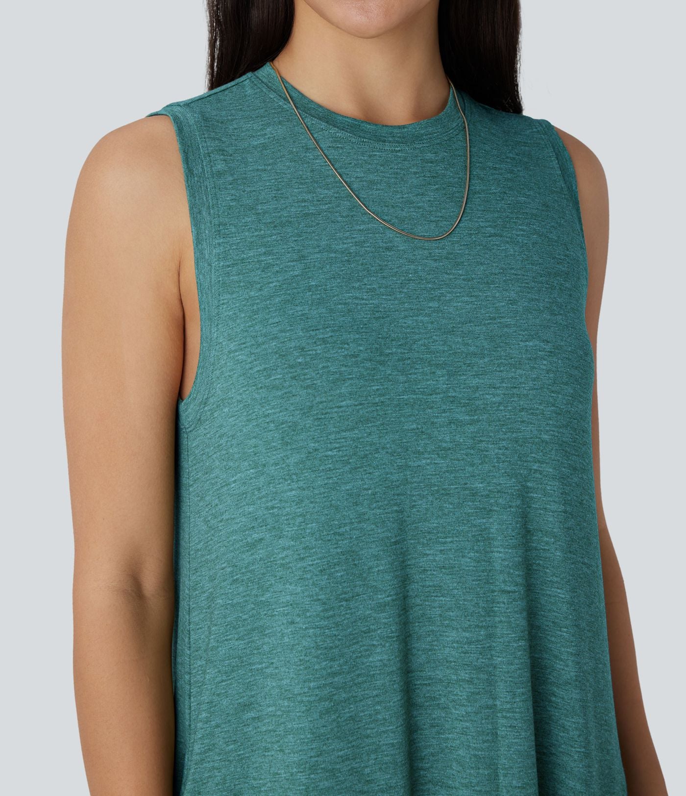 Robe longue décontractée fluide à col rond, sans manches, poches latérales et ourlet asymétrique