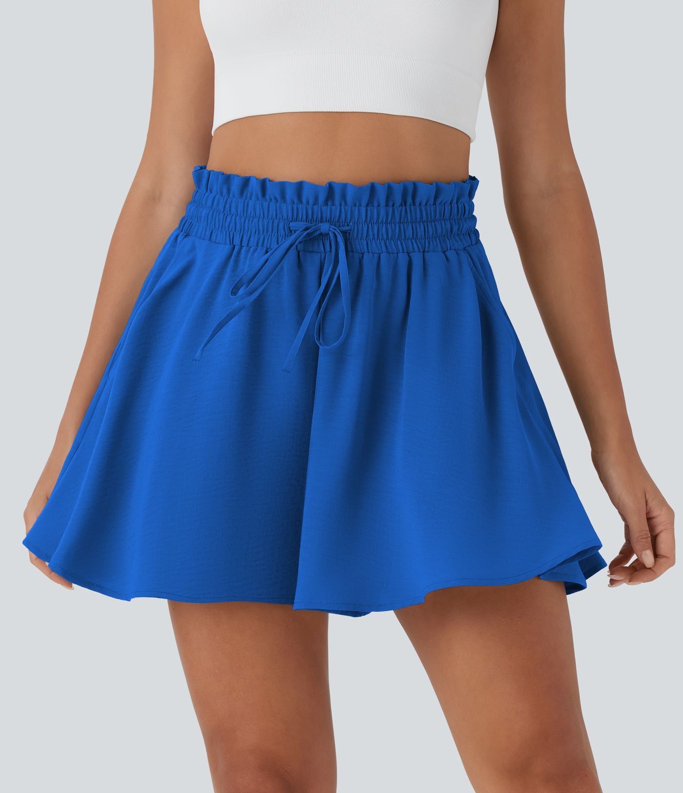 Short large décontracté taille haute façon paperbag avec cordon, poches latérales et aspect lin