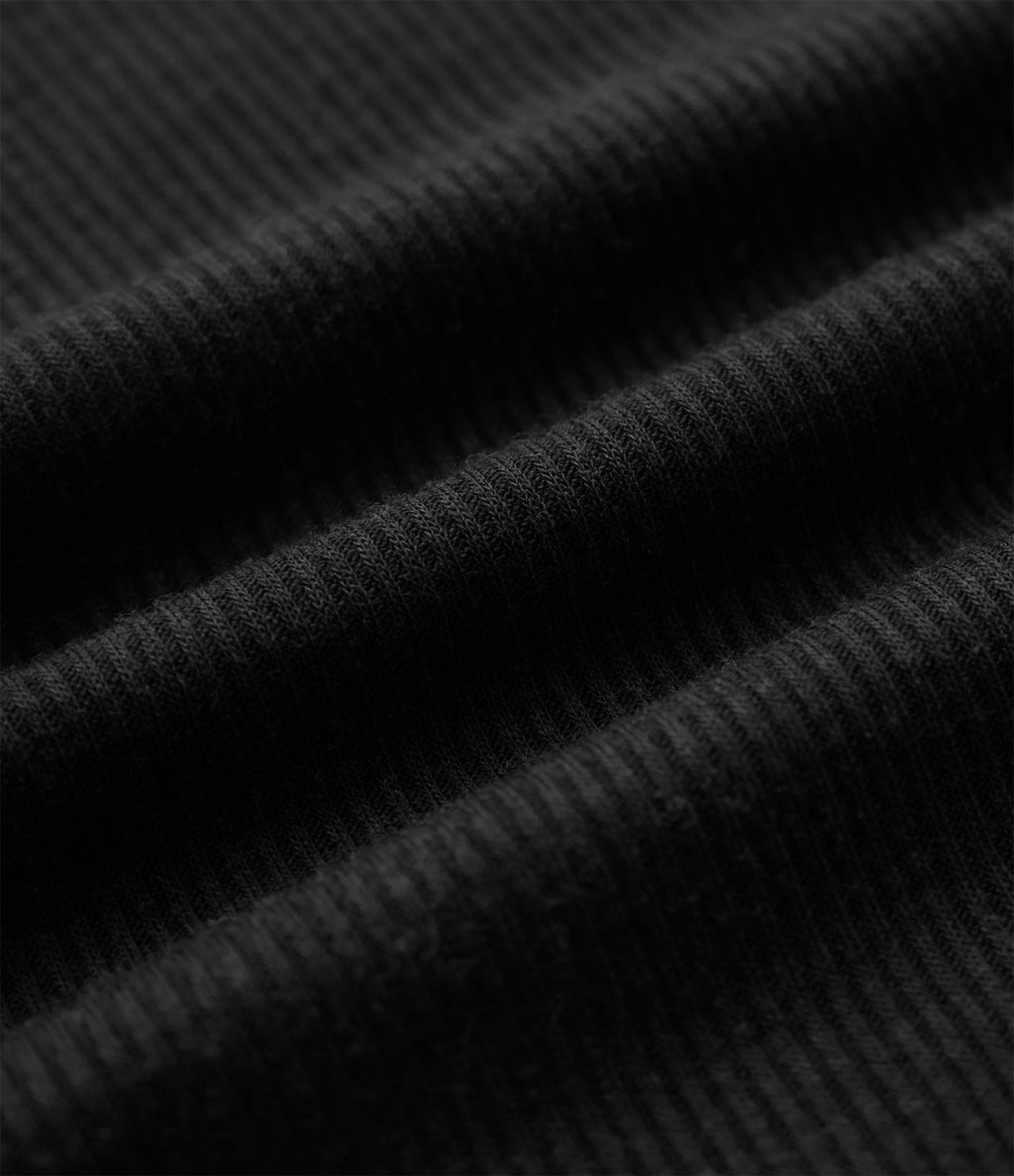 Top tailleur en mélange de laine col rond échancré à manches courtes en maille côtelée