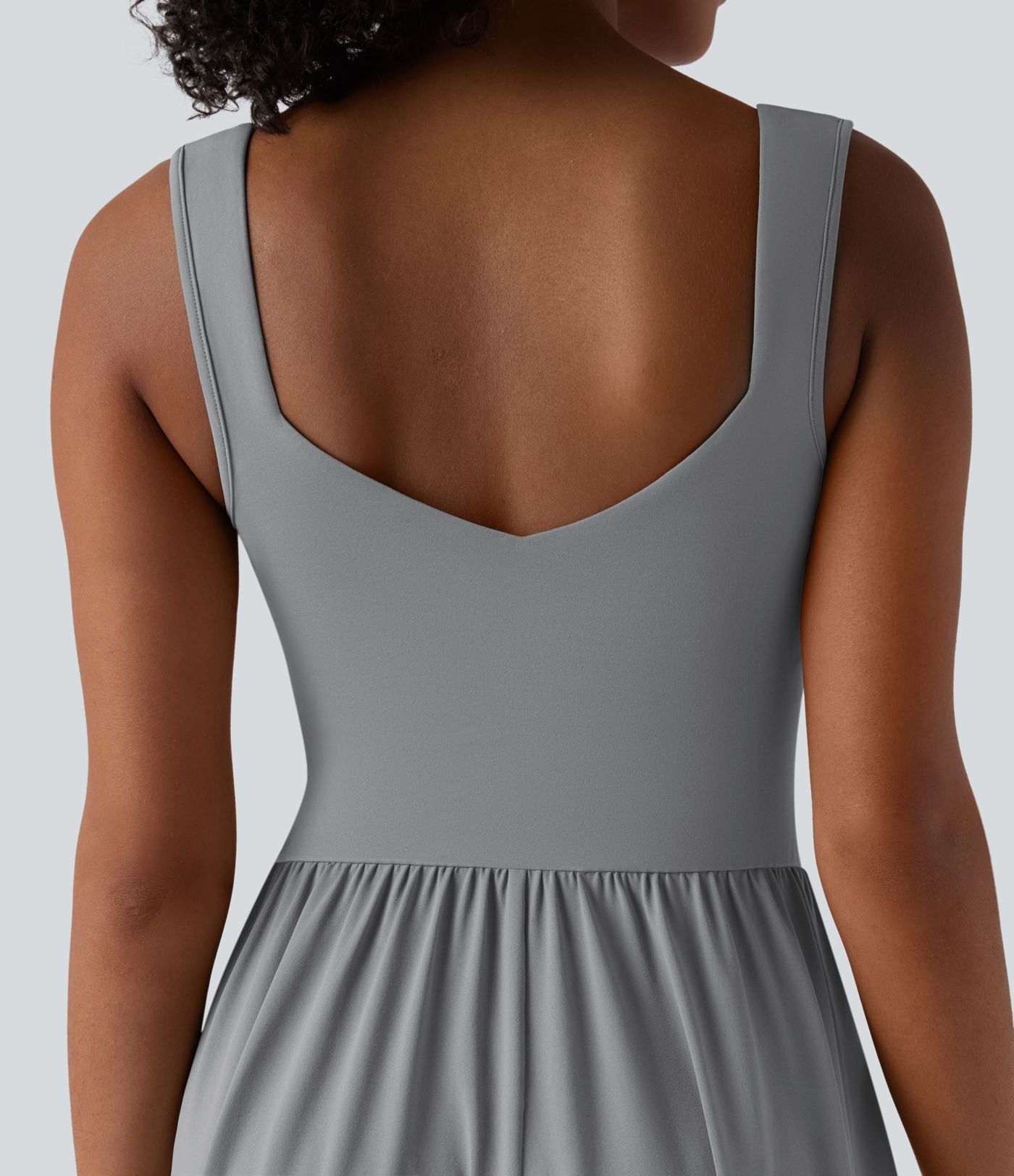 Robe midi fluide sans manches dos croisé ouvert avec poches