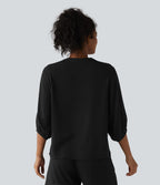 Blouse de villégiature à col Henley et manches 3/4, aspect lin.