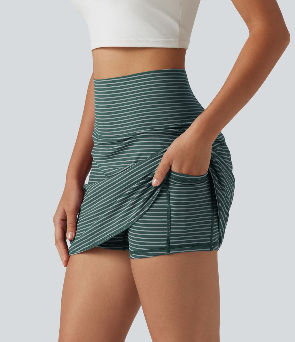 Mini-jupe de golf 2 en 1 à rayures, taille ultra haute, effet ventre plat, ourlet arrondi et poches