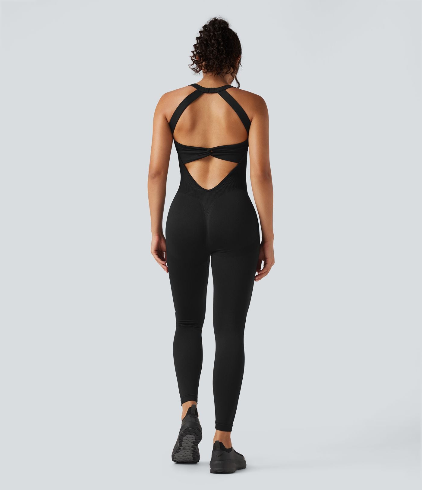 Combinaison d'entraînement ajustée dos nu torsadé sans manches sans couture Seamless Flow