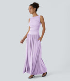 Robe longue à encolure bateau, bretelles asymétriques, côtés froncés et poches