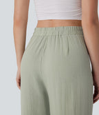Pantalon large et fluide aspect lin taille haute, boutonné avec poches